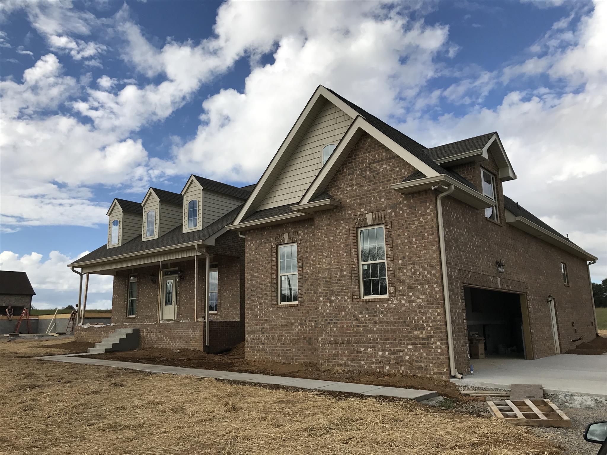 479 Halltown Road Portland, TN 37148 - Photo 2 of 25 a front view of a house with garden