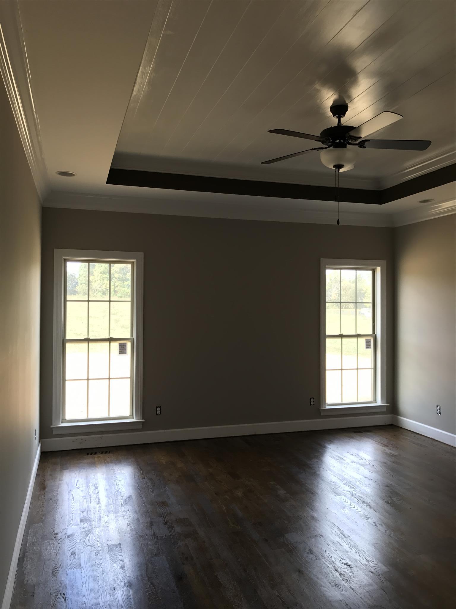 479 Halltown Road Portland, TN 37148 - Photo 14 of 25 an empty room with wooden floor and windows