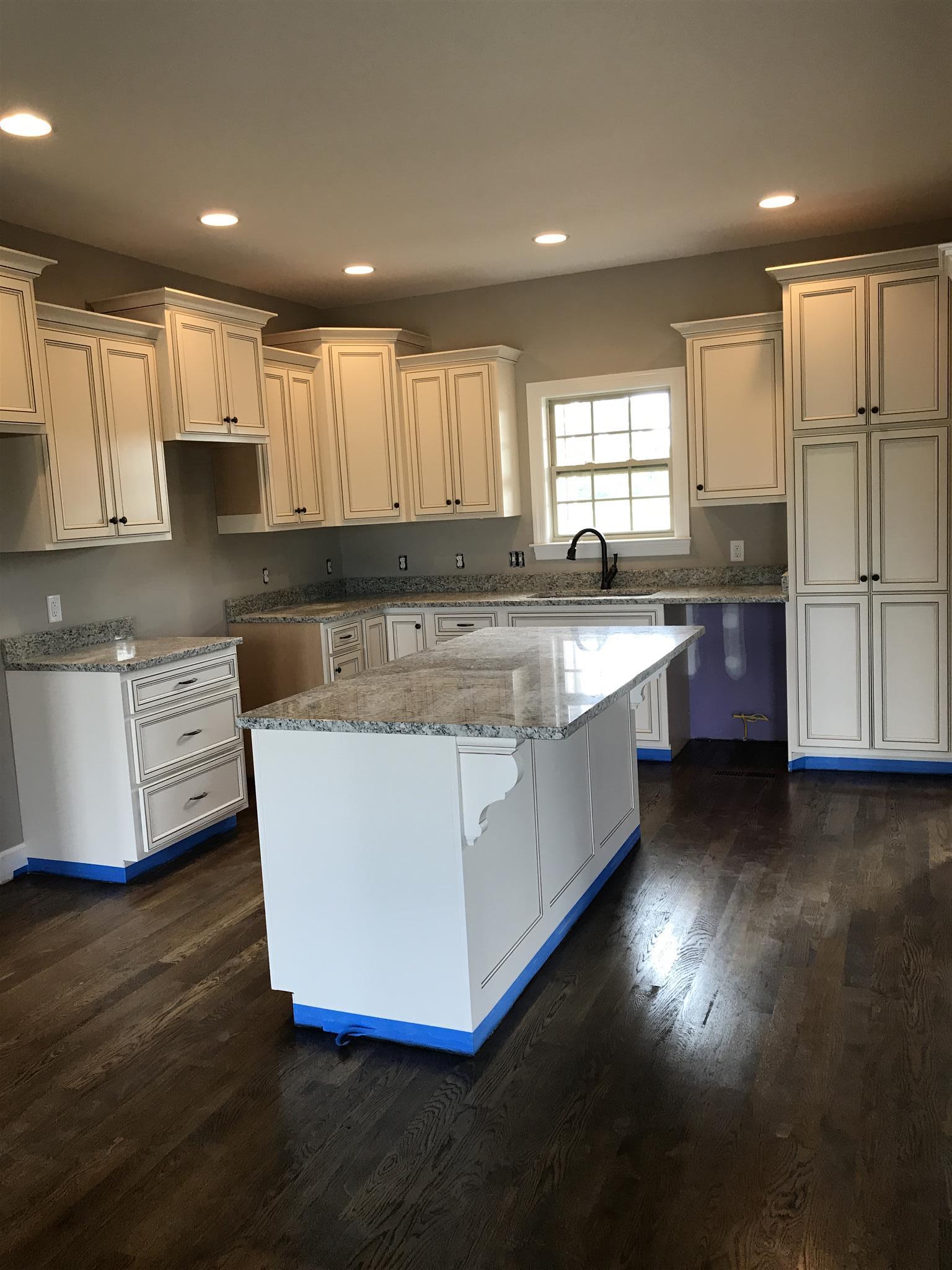 479 Halltown Road Portland, TN 37148 - Photo 8 of 25 a large kitchen with stainless steel appliances granite countertop a stove a sink dishwasher and a refrigerator