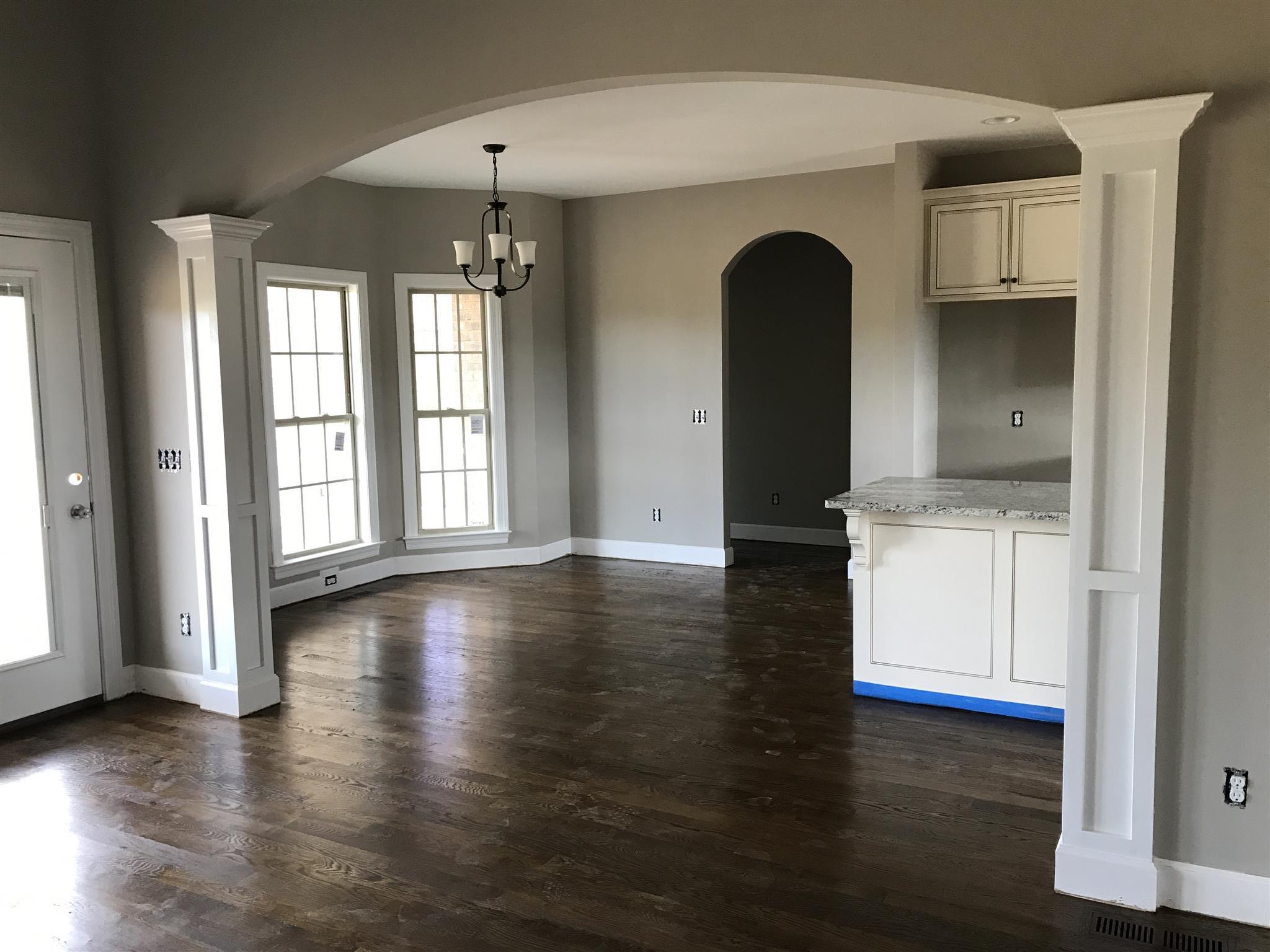 479 Halltown Road Portland, TN 37148 - Photo 9 of 25 a view of a kitchen with a large window and wooden floor