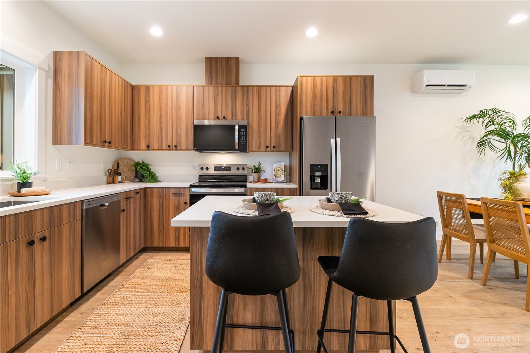 4237 Ambrosia Lane Bellingham, WA 98226 - Photo 14 of 32 a kitchen with a table chairs refrigerator and microwave