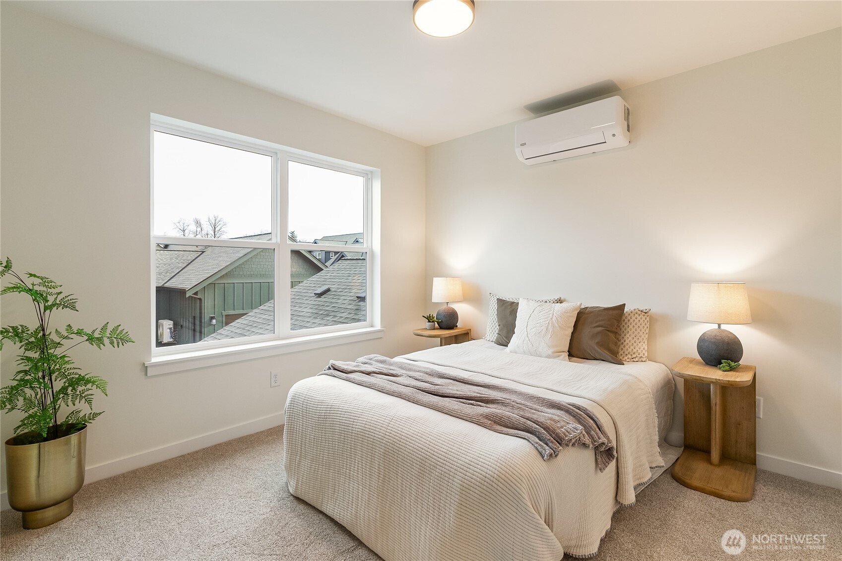 4237 Ambrosia Lane Bellingham, WA 98226 - Photo 20 of 32 a bedroom with a bed and a potted plant