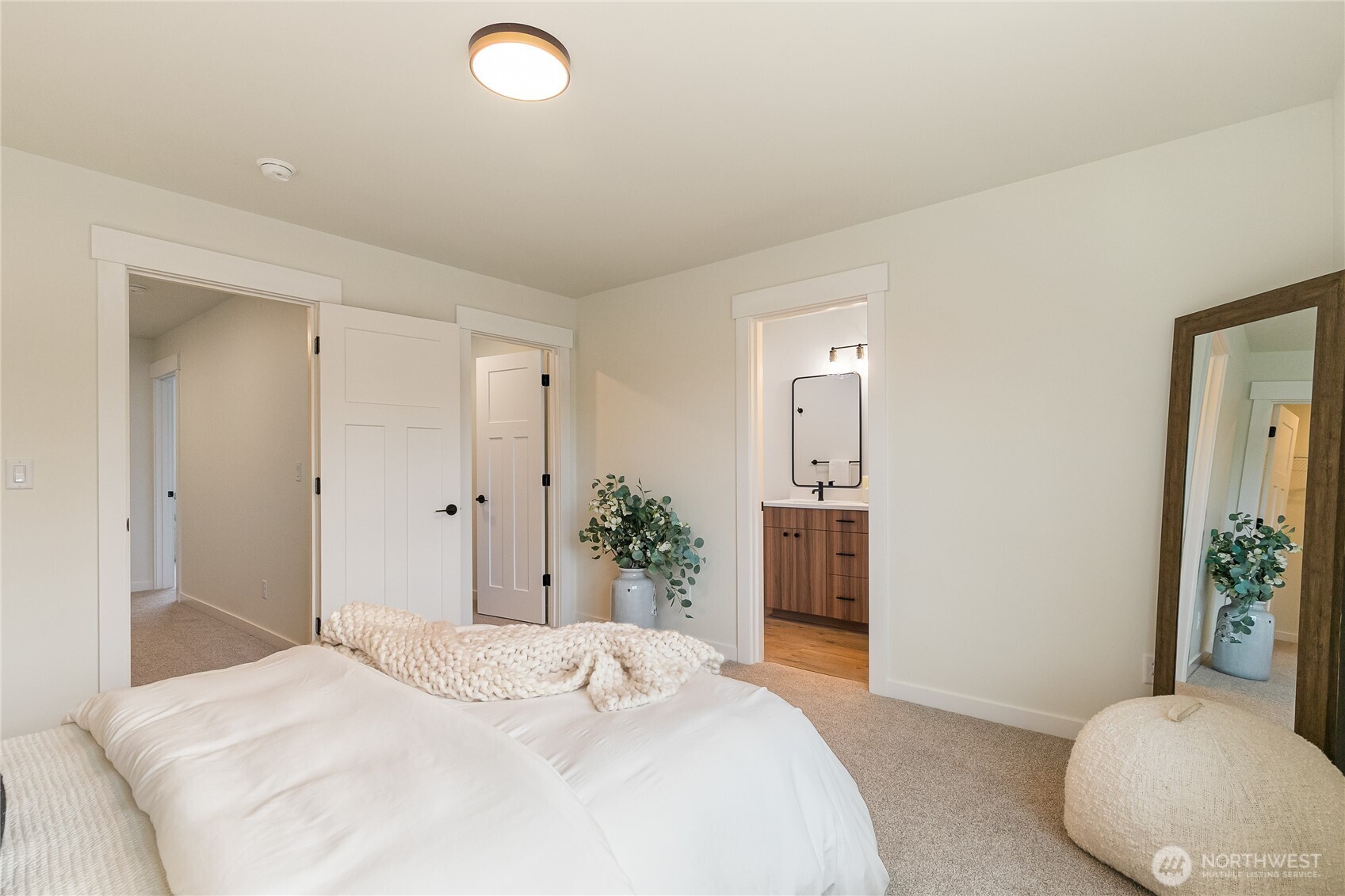4237 Ambrosia Lane Bellingham, WA 98226 - Photo 25 of 32 a bedroom with a large bed and chandelier