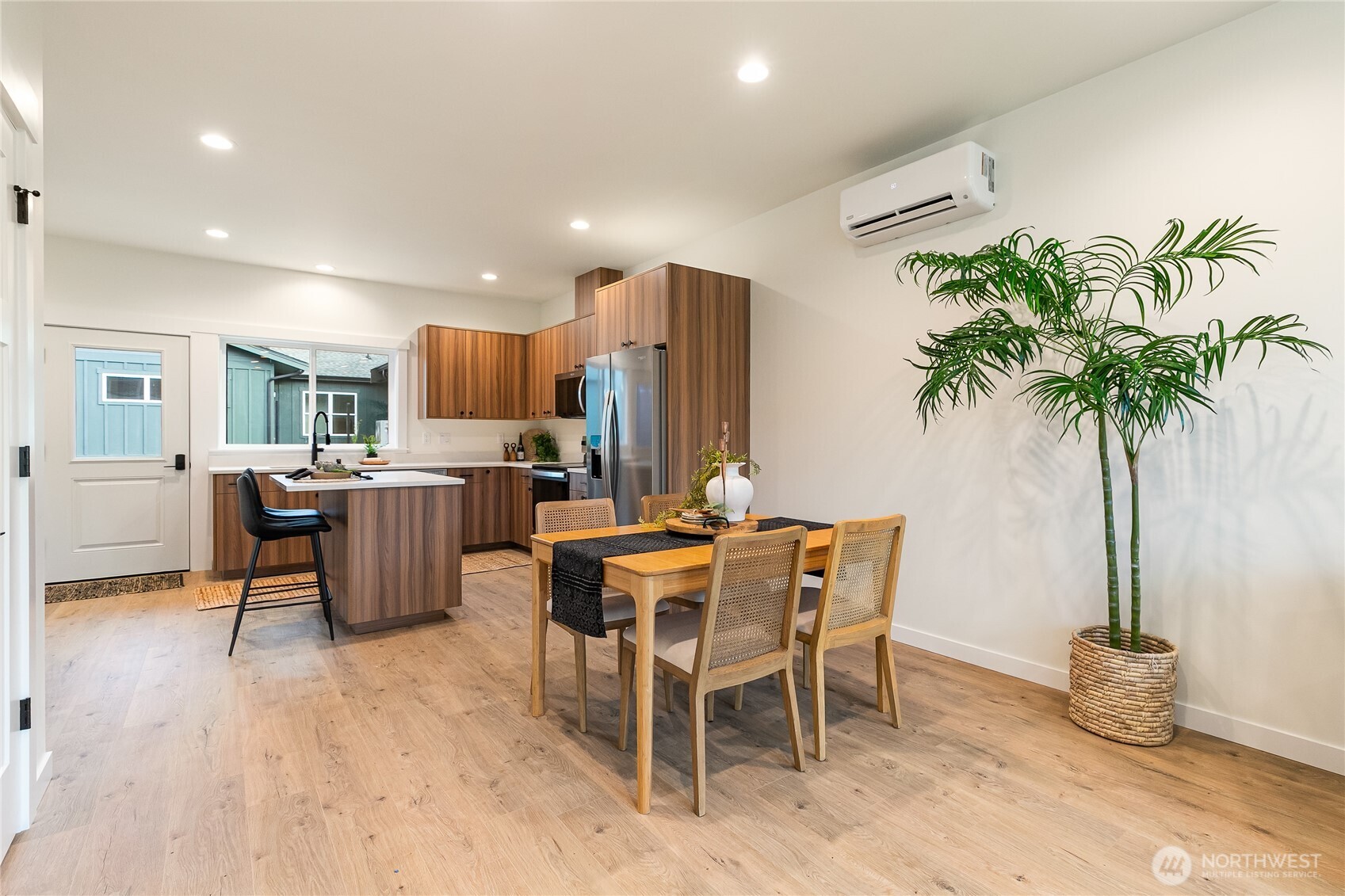 4237 Ambrosia Lane Bellingham, WA 98226 - Photo 10 of 32 a view of a dining room with furniture and a potted plant