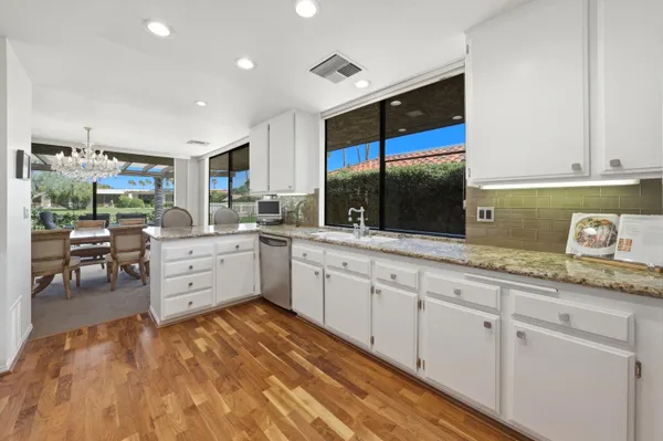 a kitchen with sink and cabinets