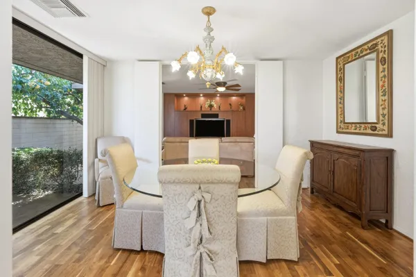 a view of a dining room with furniture window and wooden floor