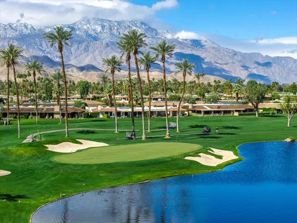 a view of a golf course with a swimming pool