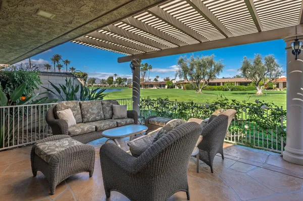 a patio with table and chairs