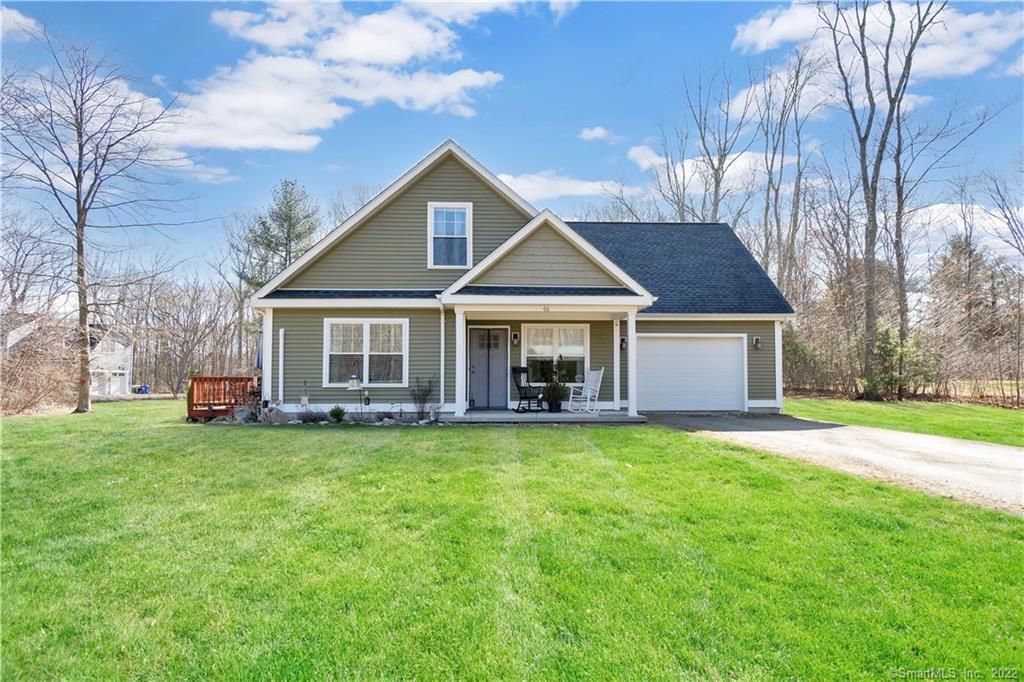 66 Beebe Farms Road Coventry, CT 06238 - Photo 1 of 1 a front view of a house with a garden and trees