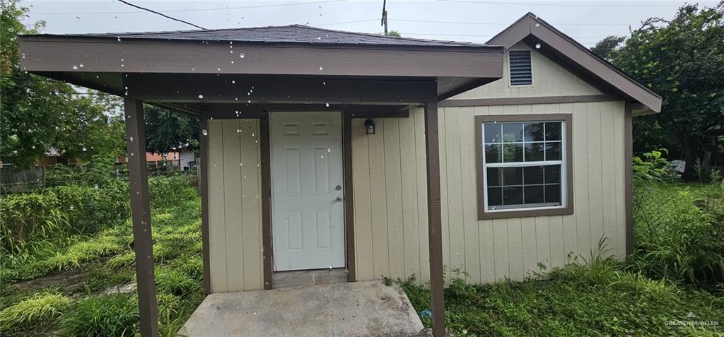a front view of a house with a yard garage and outdoor seating