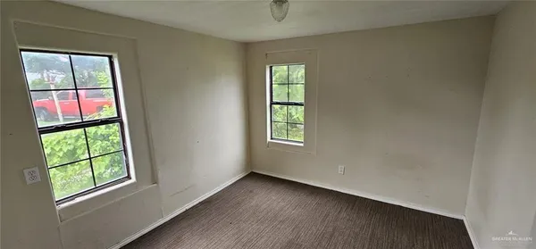 an empty room with windows
