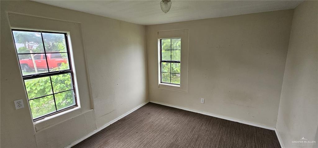 511 West Hawk Avenue, Unit B Pharr, TX 78577 - Photo 2 of 3 an empty room with windows