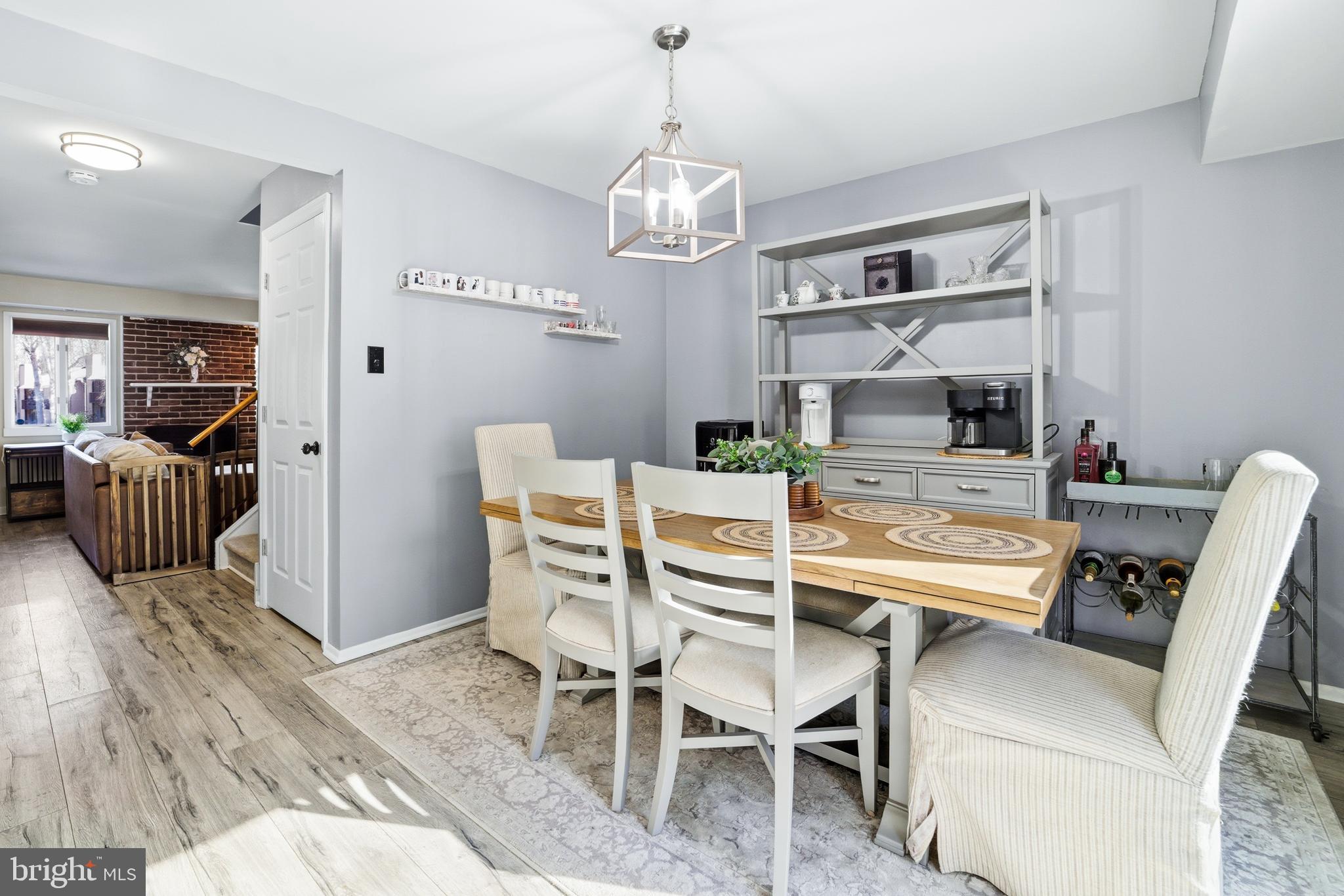 51 Harwood Lane, Unit BB Clementon, NJ 08021 - Photo 13 of 30 a dining room with furniture a chandelier and wooden floor