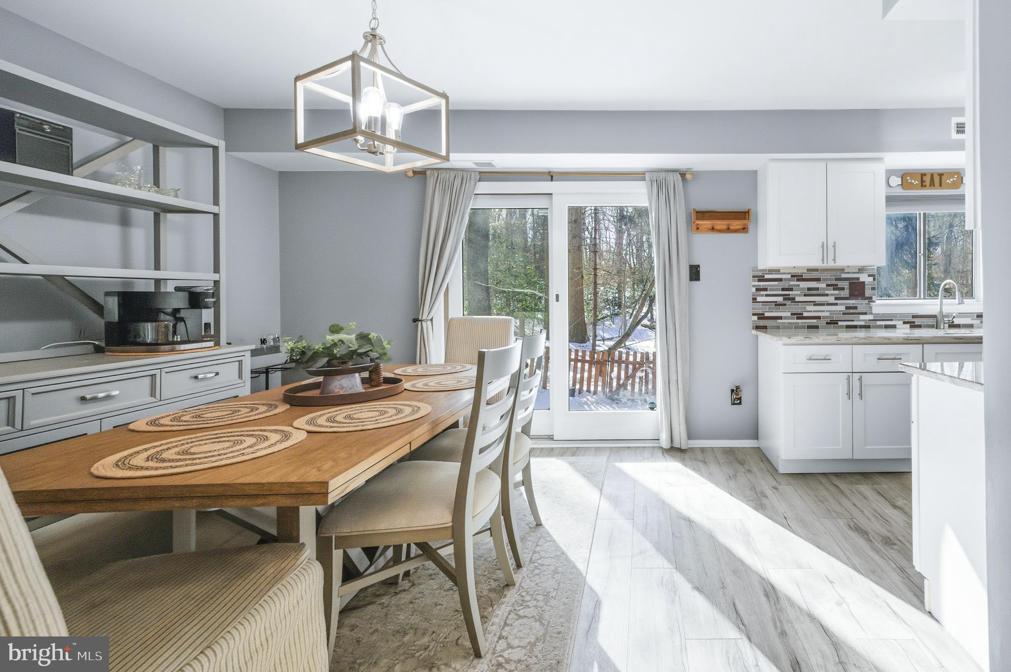 51 Harwood Lane, Unit BB Clementon, NJ 08021 - Photo 10 of 30 a dining room with furniture a chandelier and wooden floor