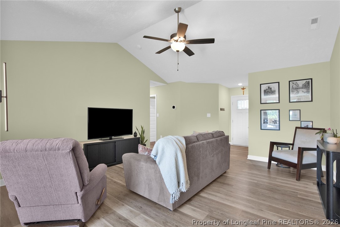 351 Sandy Grove Road Parkton, NC 28371 - Photo 5 of 30 a living room with furniture and a flat screen tv