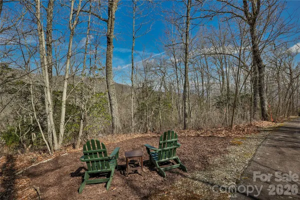 a view of backyard with a table and chairs