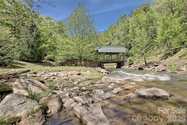 a view of a backyard with sitting area