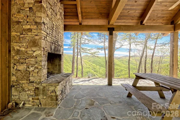 a living room with a fireplace furniture and a flat screen tv