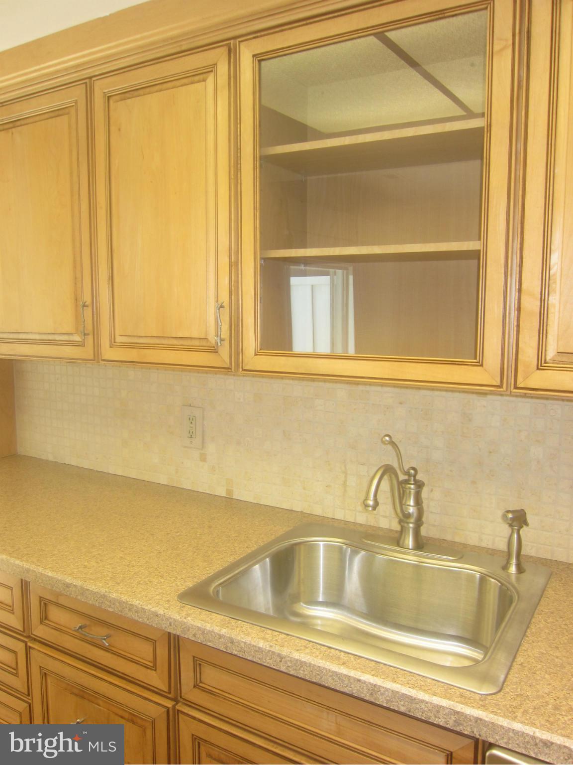 3606 Edelmar Terrace, Unit 128A Silver Spring, MD 20906 - Photo 8 of 30 Glass door dispaly cabinet
