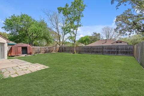 a view of a backyard with a garden