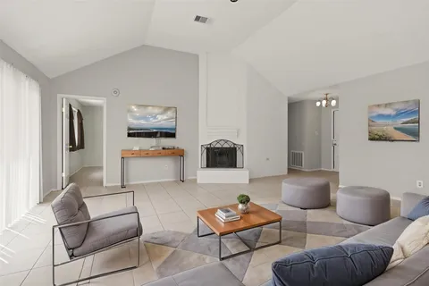 a living room with furniture and a couch