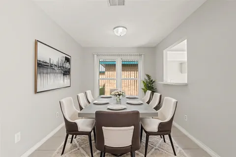 a view of a dining room with furniture window and outside view