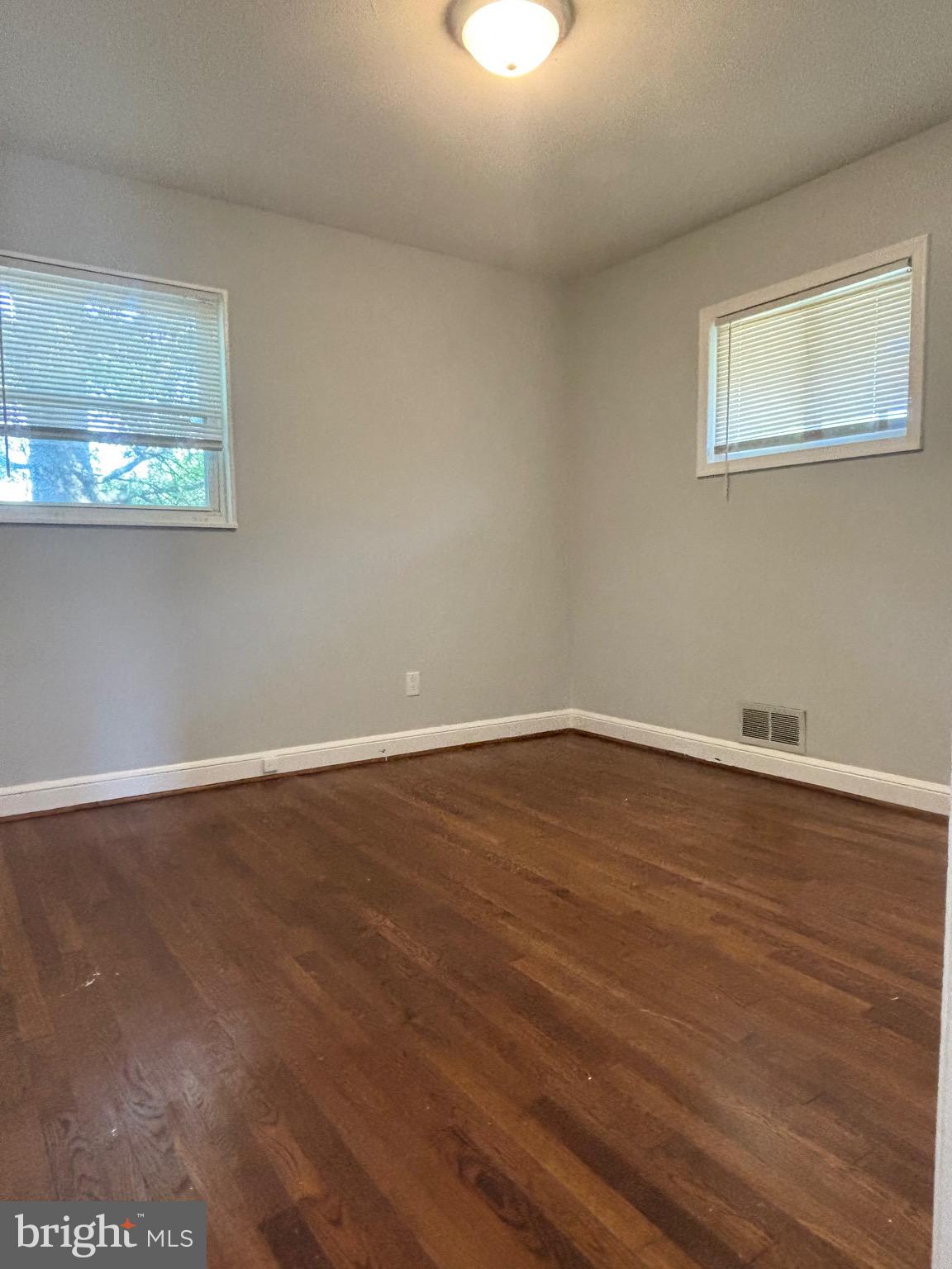 9103 Wallace Road Lanham, MD 20706 - Photo 13 of 30 a view of a room with wooden floor and window