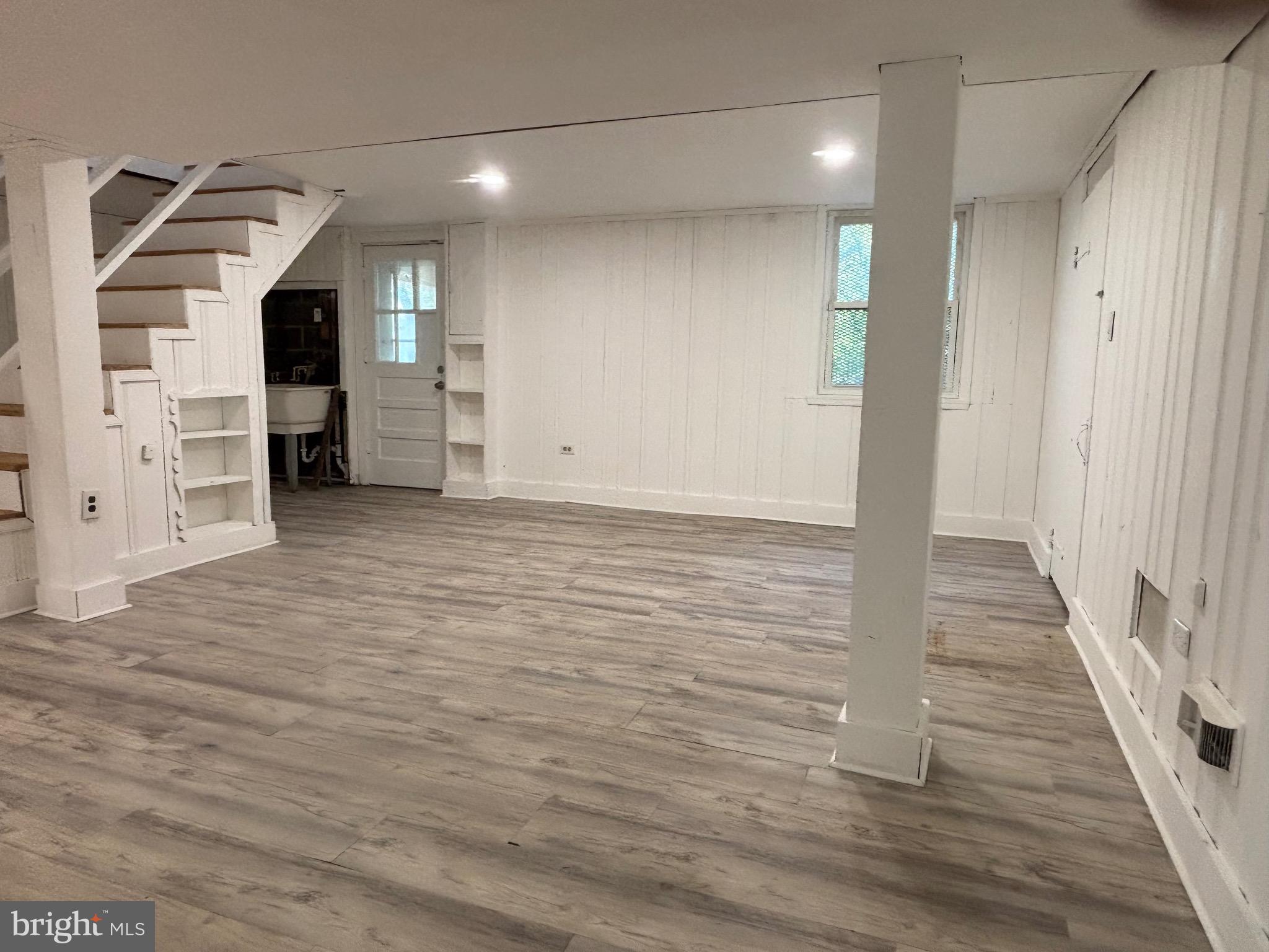 9103 Wallace Road Lanham, MD 20706 - Photo 17 of 30 a view of a hallway with wooden floor and closet
