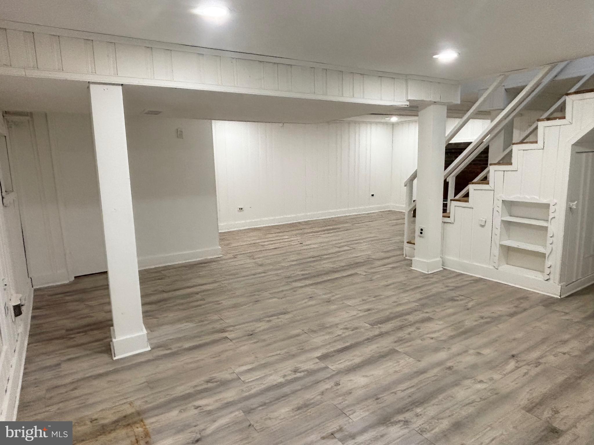 9103 Wallace Road Lanham, MD 20706 - Photo 18 of 30 a view of a livingroom with wooden floor and stairs