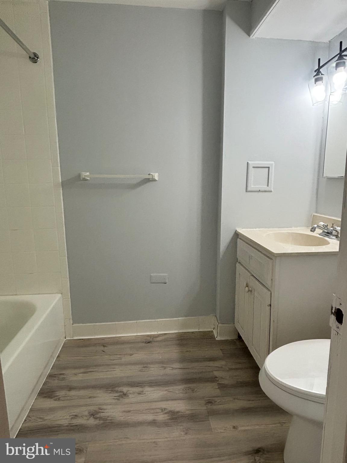 9103 Wallace Road Lanham, MD 20706 - Photo 21 of 30 a bathroom with a sink a toilet and shower