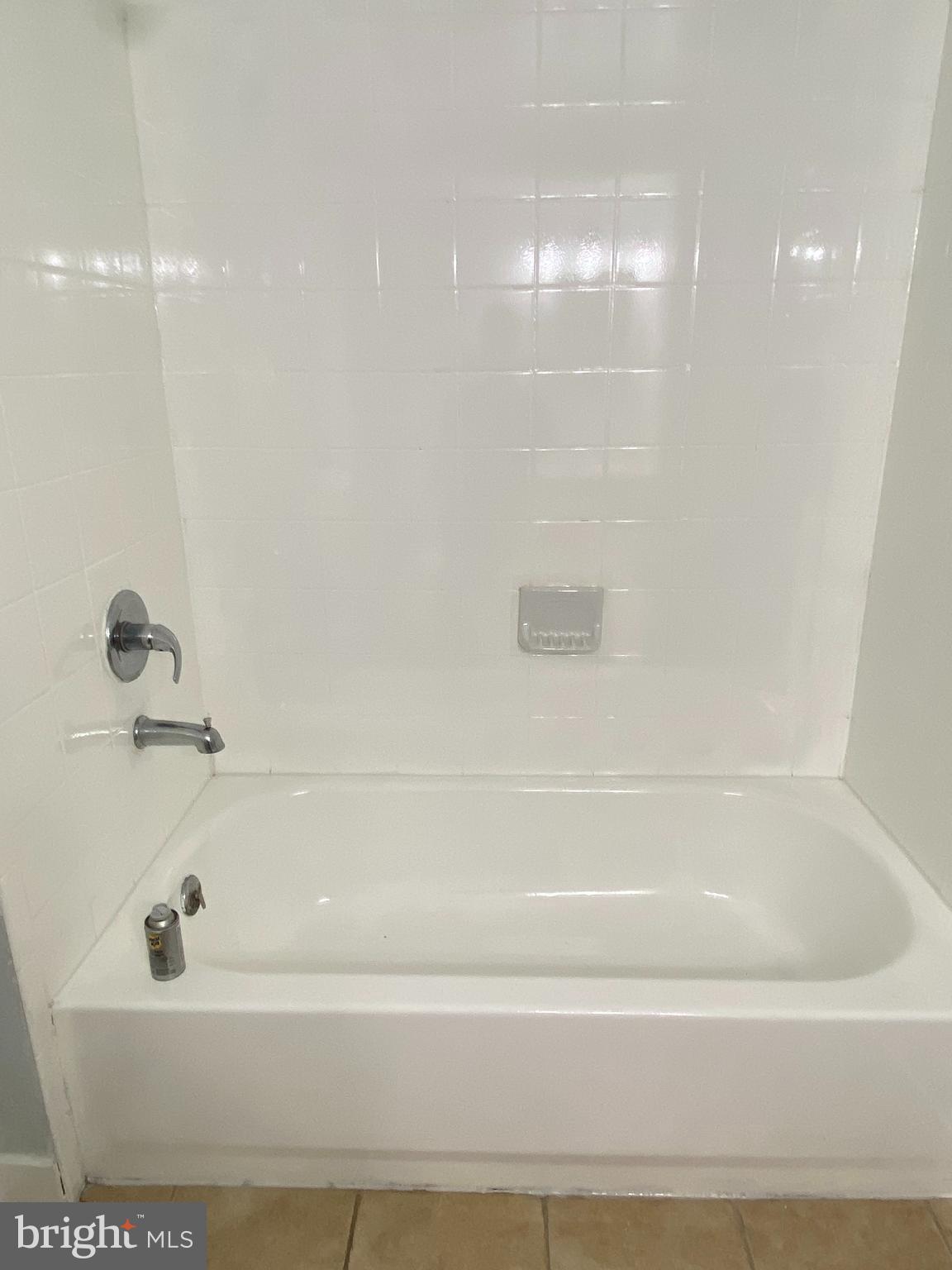 9103 Wallace Road Lanham, MD 20706 - Photo 22 of 30 a bathroom with a bathtub