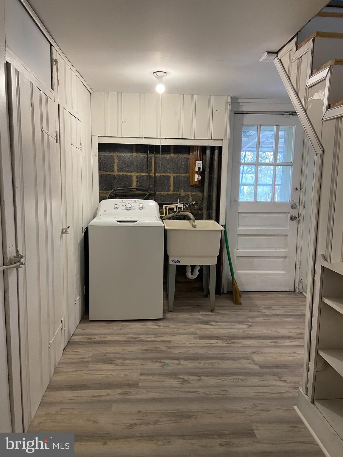 9103 Wallace Road Lanham, MD 20706 - Photo 23 of 30 a view of a room with washer and dryer