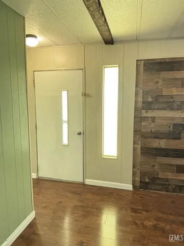 a view of backyard with deck and wooden floor