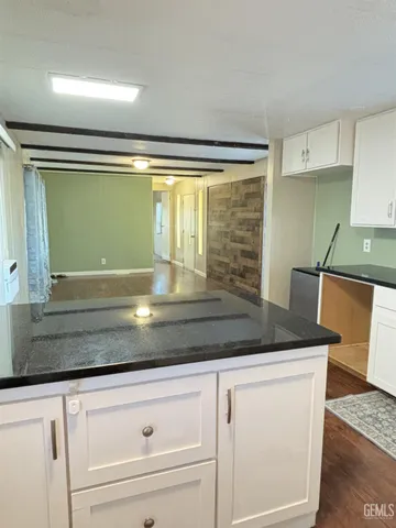a close view of sink and cabinets
