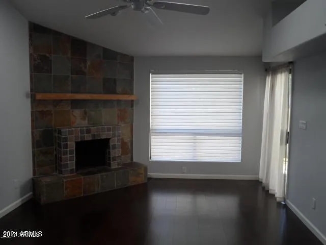 a living room with a fireplace and a window
