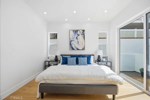 a bedroom with a bed and a walk in closet