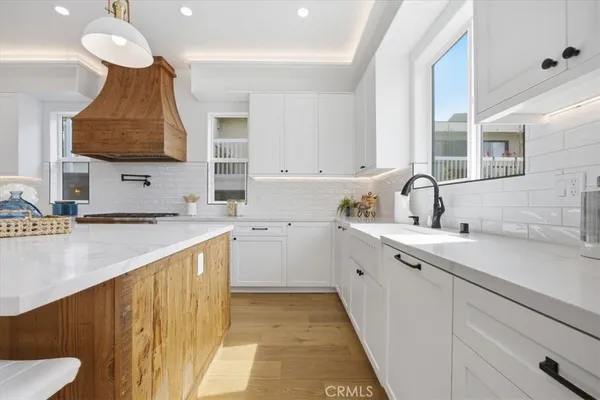a kitchen with a sink and cabinets