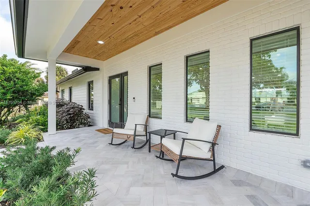 a view of a chairs in back yard of the house