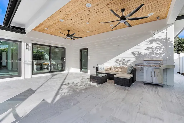 a outdoor space with patio furniture and flat screen tv