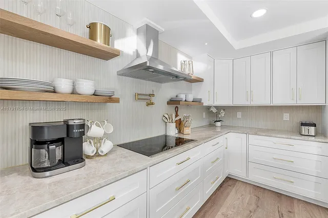 a kitchen with a sink dishwasher and cabinets
