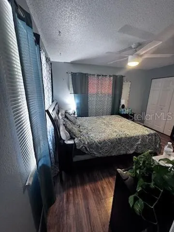 a bathroom with a sink a toilet a mirror a vanity and shower