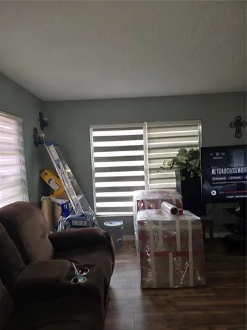 a living room with furniture and a window