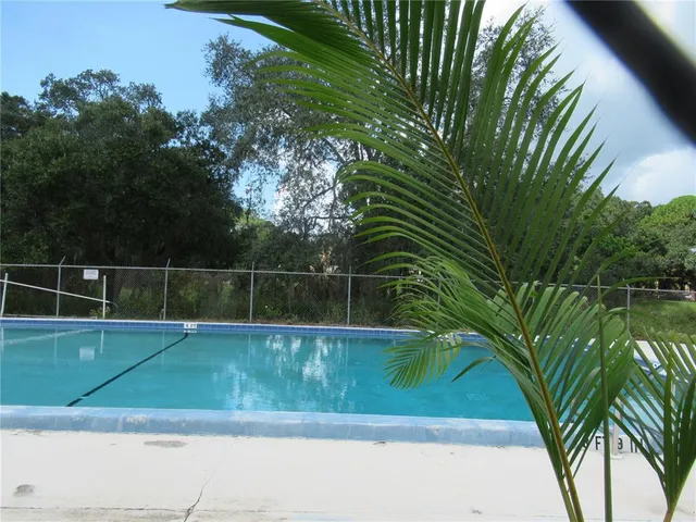 a view of a yard with a trampoline