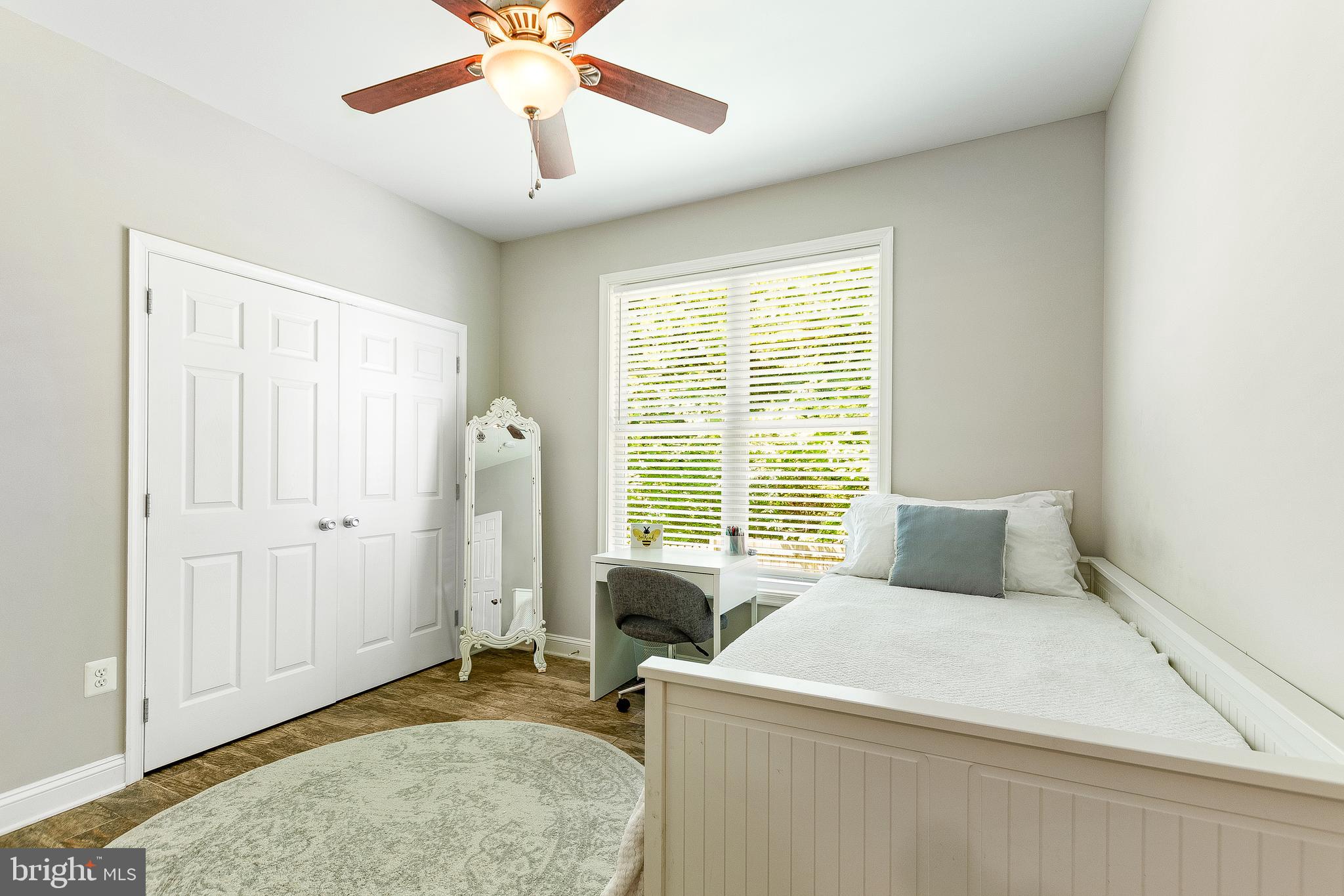 1808 Wilson Road Huntingtown, MD 20639 - Photo 30 of 53 a bedroom with a bed and a chandelier