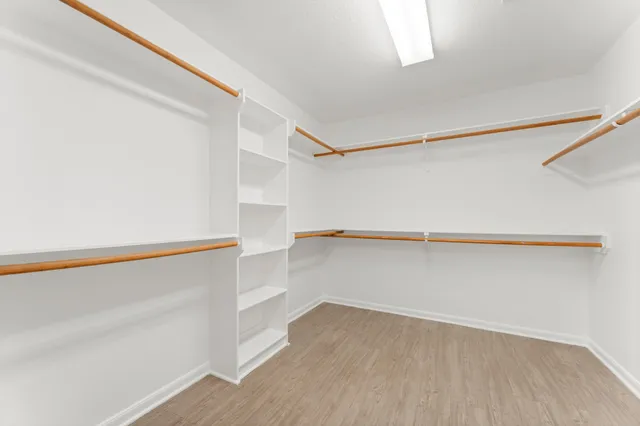 a view of an empty walk in closet