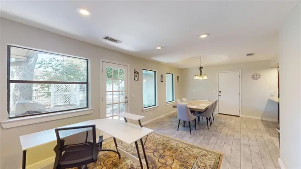 a dining room with furniture and window