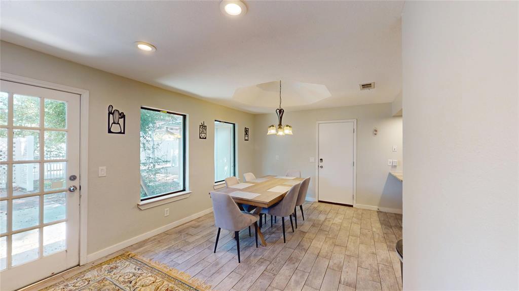 411 Sycamore Creek Road Allen, TX 75002 - Photo 12 of 36 a view of a room with a table and chairs