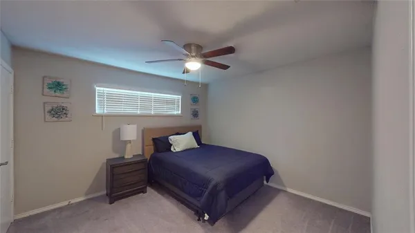 a living room with a bed furniture and a window