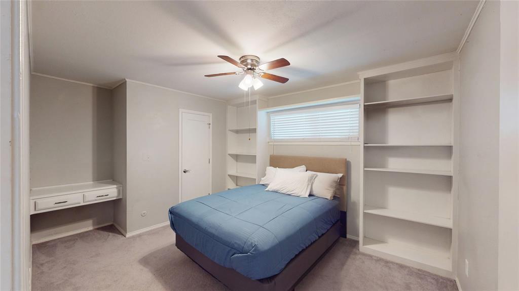 411 Sycamore Creek Road Allen, TX 75002 - Photo 19 of 36 a bedroom with a bed and a ceiling fan
