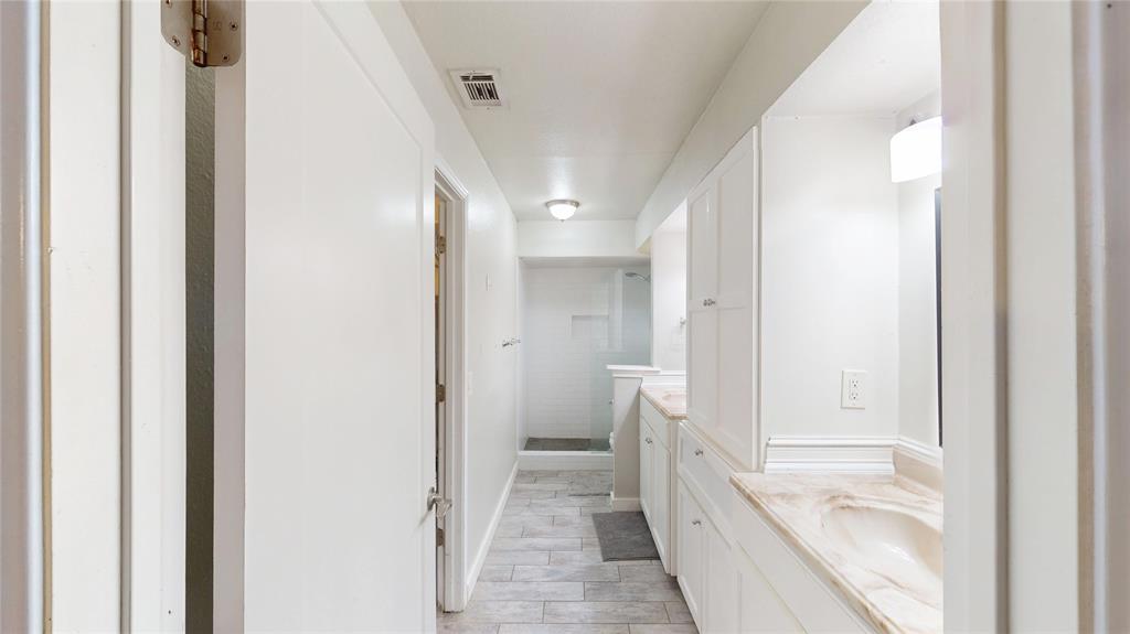 411 Sycamore Creek Road Allen, TX 75002 - Photo 21 of 36 a bathroom with a tub and shower